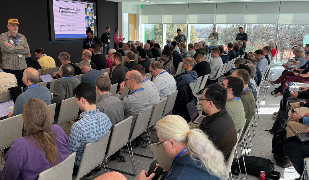 Photo of a crowd listening to Ernest Koe give a session on AI at the Claris Engage 2024 Speaker Sessions