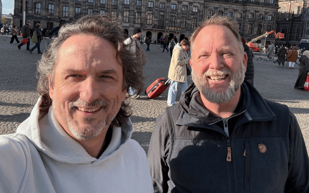 Todd Geist and Dirk Reynolds taking a photo together as they meet up to go to EngageU